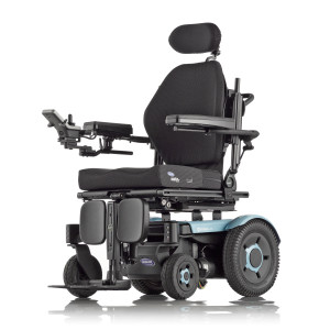 Image of a modern electric wheelchair with padded seating and adjustable headrest. The wheelchair has a joystick control panel, armrests, and footrests, and features large, durable wheels suitable for various terrains. Its frame is sleek and black.