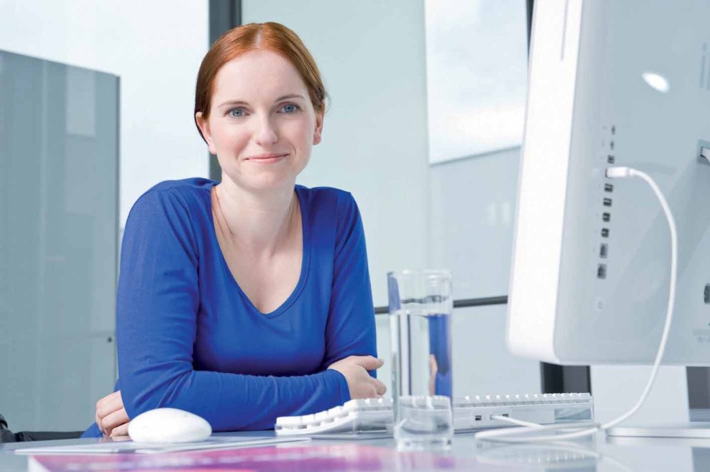 Woman looking at Resources on PC